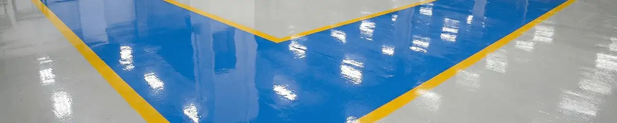 A factory floor professionally covered and marked with epoxy flooring in Portland, OR