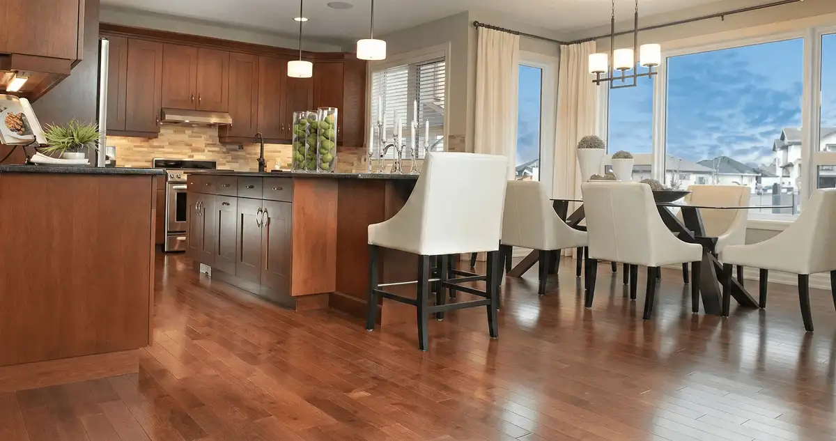 A modern kitchen with professionally installed wood flooring in Portland, OR
