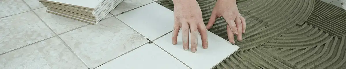 Professional installing white tile floors in Portland, OR