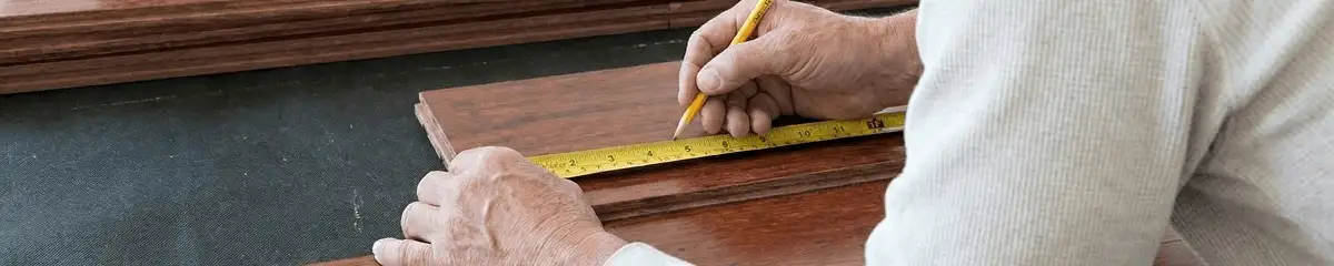 A professional installing wood flooring in Portland, OR